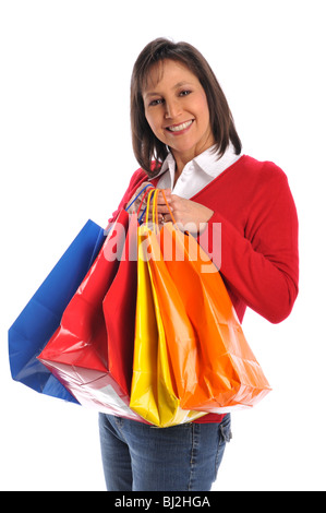 L'âge moyen woman with shopping bags smiling isolé sur fond blanc Banque D'Images