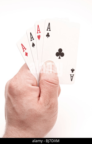 Quatre As dans la main on white Banque D'Images