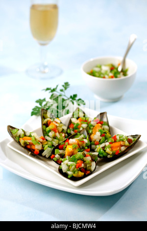 Aigre-doux les moules. Recette disponible. Banque D'Images