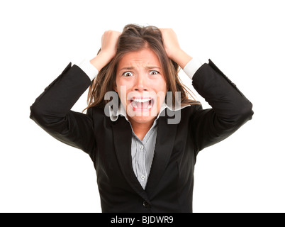 La frustration. Frustré et a souligné young businesswoman in suit. Belle asiatique / young mixed race woman isolated Banque D'Images