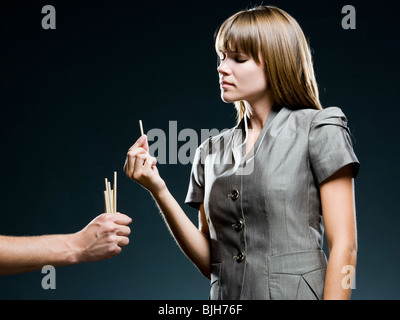 Businesswoman drawing pailles Banque D'Images