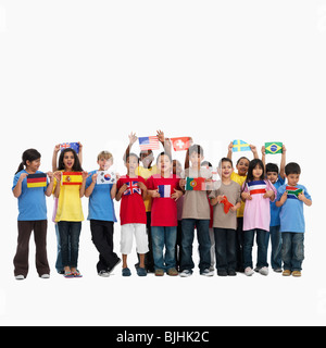 Enfants holding flags Banque D'Images