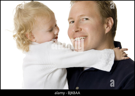 Man holding et en l'embrassant sur la joue fille Banque D'Images