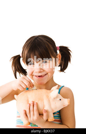 Little Girl with piggy bank Banque D'Images