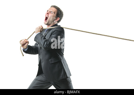 Businessman tirant une corde Banque D'Images