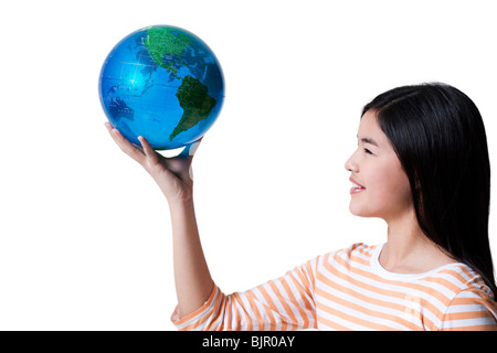 Teenage Girl standing with a globe Banque D'Images