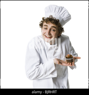 Chef avec cupcake Banque D'Images