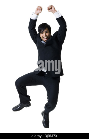 Businessman jumping dans l'air Banque D'Images