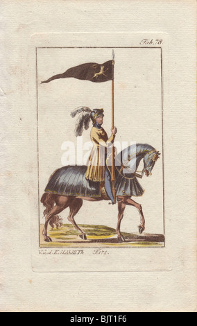 Chevalier en armure montée sur un cheval et en affichant son blindé standard - un lion d'or sur noir un fanion. Banque D'Images