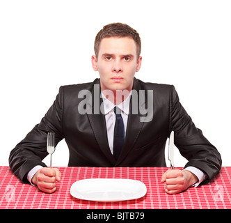 Un homme d'attendre son repas Banque D'Images