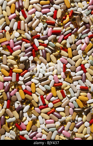 Un contexte de gélules, comprimés colorés et des pilules Banque D'Images
