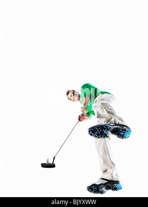 Man playing golf shot Banque D'Images