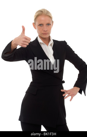 Portrait of a young caucasian businesswoman with thumb up et l'air agressif portant une chemise et pantalon. Banque D'Images