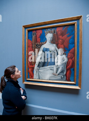 Visiteur à la recherche de peinture à Marie et Jésus entouré de séraphins et chérubins par Jean Fouquet au Royal Museum of Fine Arts de Banque D'Images