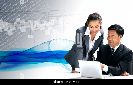 Homme d'affaires et business woman looking at laptop parler,digital composite Banque D'Images