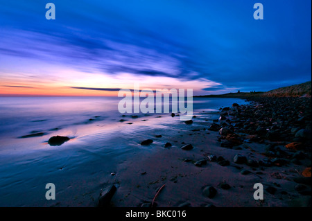 Lever de soleil sur l'Embleton Bay, Northumberland Banque D'Images