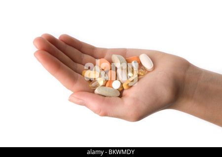 Hand holding pills Banque D'Images