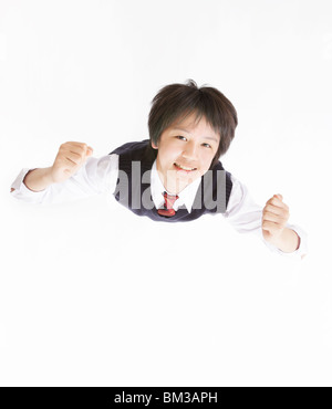 Portrait of businesswoman looking up, smiling, fond blanc Banque D'Images