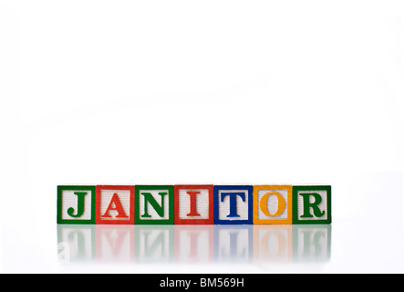 Enfants colorés blocks spelling JANITOR Banque D'Images