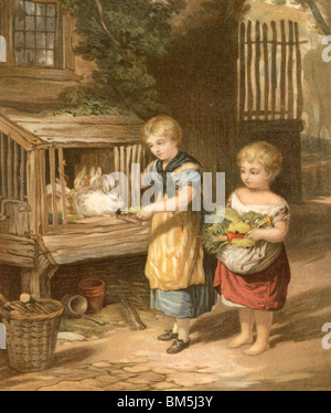 'Les enfants et leurs lapins' Banque D'Images