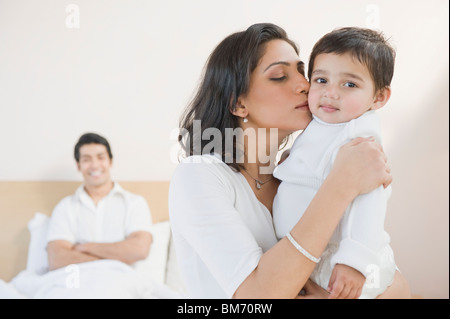 Woman kissing her baby Banque D'Images