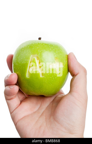 La pomme verte et un signe plus, Concept de l'apprentissage Banque D'Images