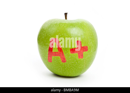 La pomme verte et un signe plus, Concept de l'apprentissage Banque D'Images