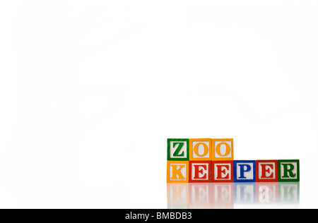 Enfants colorés blocks spelling ZOO KEEPER Banque D'Images