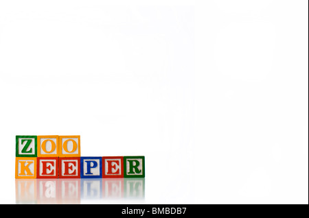 Enfants colorés blocks spelling ZOO KEEPER Banque D'Images