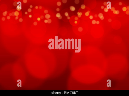 Fond rouge avec effet de lumière floue créant une atmosphère chaleureuse. Banque D'Images