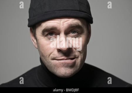 Portrait of Man in Black Cap Banque D'Images