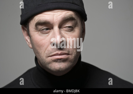 Portrait of Man in Black Cap Banque D'Images