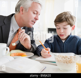 Father helping son with Homework Banque D'Images