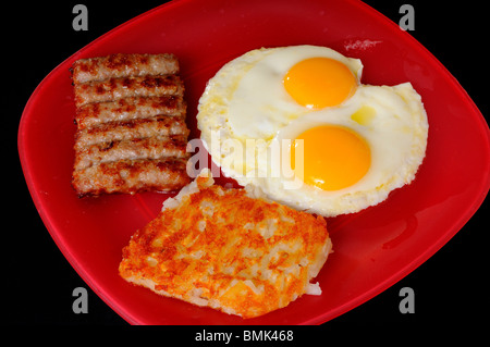 Un petit-déjeuner traditionnel d'oeufs saucisse et paillasson de pommes de terre Banque D'Images