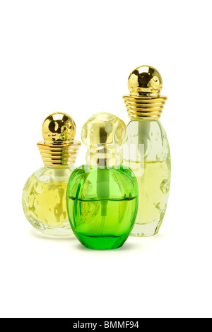 Trois bouteilles en verre de parfum sur fond blanc Banque D'Images