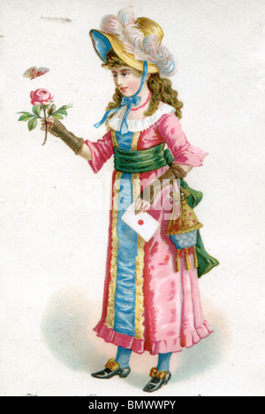 Femme en Bonnet Plume regardant un vol stationnaire au-dessus d'un papillon rose rose Banque D'Images