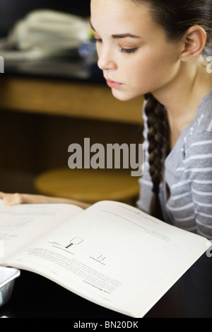 Female student reading textbook