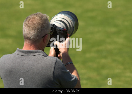 Téléobjectif moyen photographe sportif Banque D'Images