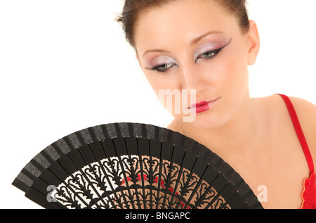 Portrait of teenage girl holding ventilateur japonais, studio shot Banque D'Images