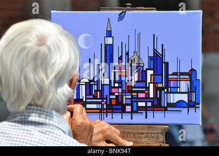 Un homme âgé de la peinture sur la rue à Venise, Italie Banque D'Images