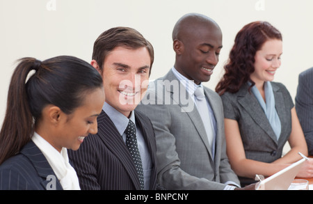 Smiling handsome businessman working Banque D'Images