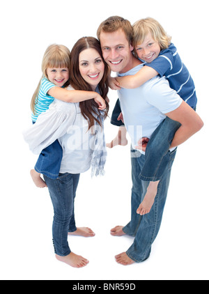 Smiling Family Against A White Background Banque D'Images