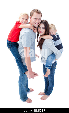 Smiling Family Against A White Background Banque D'Images
