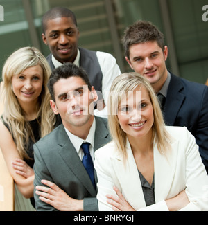 Smiling business team looking at the camera Banque D'Images