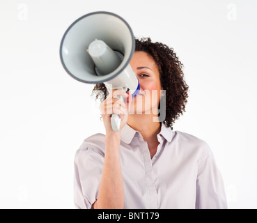 Businesswoman yelling through megaphone Banque D'Images
