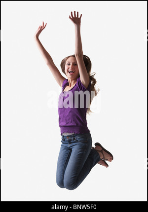 Teenage girl jumping for joy Banque D'Images