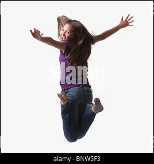 Teenage girl jumping for joy Banque D'Images