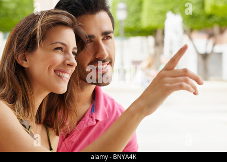 Attractive young couple in city square Banque D'Images