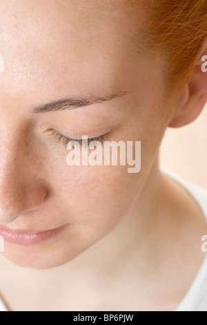 Détail d'un visage de femme rousse Banque D'Images