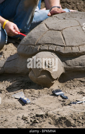 Le sable est sculpté dans la forme d'une tortue au cours de l'Olympia Hands on Children's Museum de sable dans l'événement de la ville. Banque D'Images